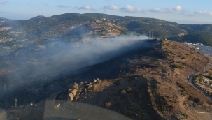 Foça'da çöplükten çıkarak otluk alana sıçrayan yangın kontrol altında