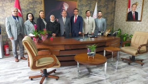 MHP Aliağa 'dan İlçe Millî Eğitim Müdürü Erdoğan Akyüz'e "Öğretmenler Günü" Ziyareti